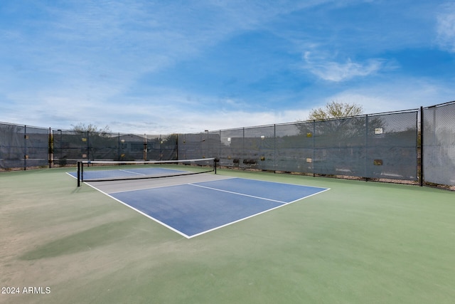 view of sport court featuring basketball hoop