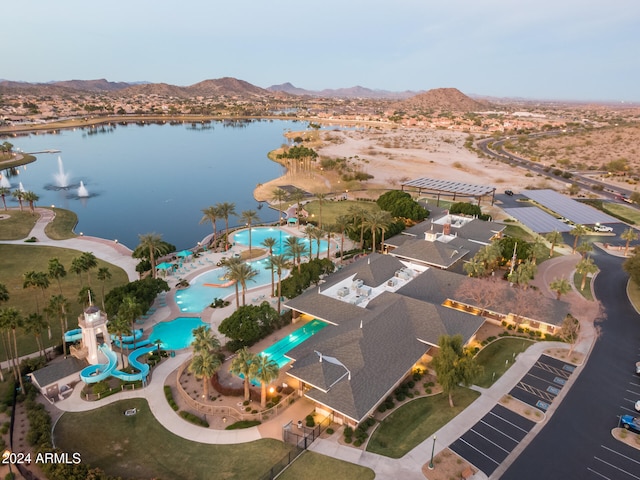 bird's eye view with a water and mountain view