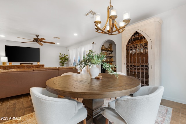 dining area with wood finished floors, visible vents, and recessed lighting