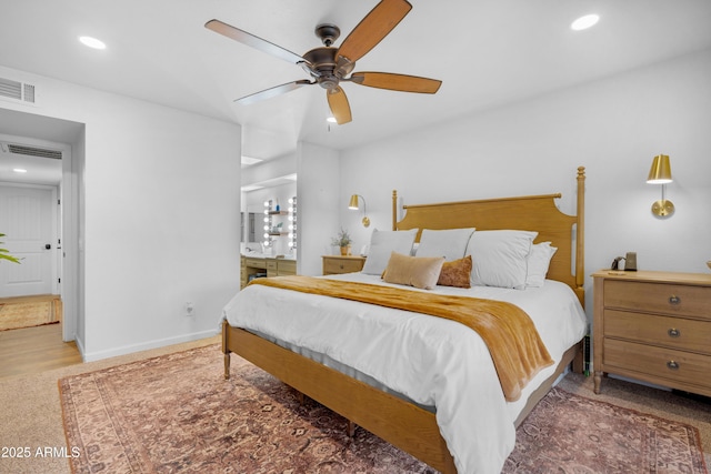 bedroom featuring baseboards, connected bathroom, visible vents, and recessed lighting