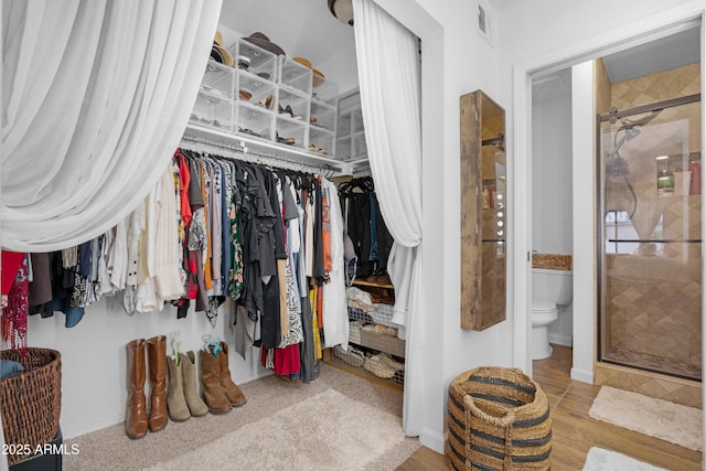 walk in closet with visible vents