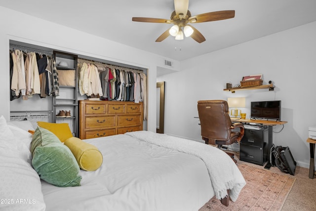 bedroom with carpet floors, ceiling fan, and visible vents