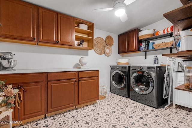 laundry area with cabinet space, separate washer and dryer, a ceiling fan, and light tile patterned flooring