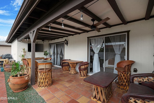 view of patio featuring a ceiling fan and outdoor dining space