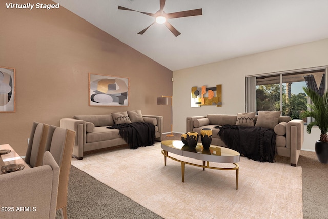 living room with light carpet, high vaulted ceiling, and a ceiling fan