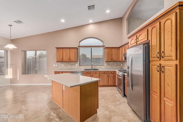 kitchen featuring tasteful backsplash, visible vents, light countertops, and appliances with stainless steel finishes