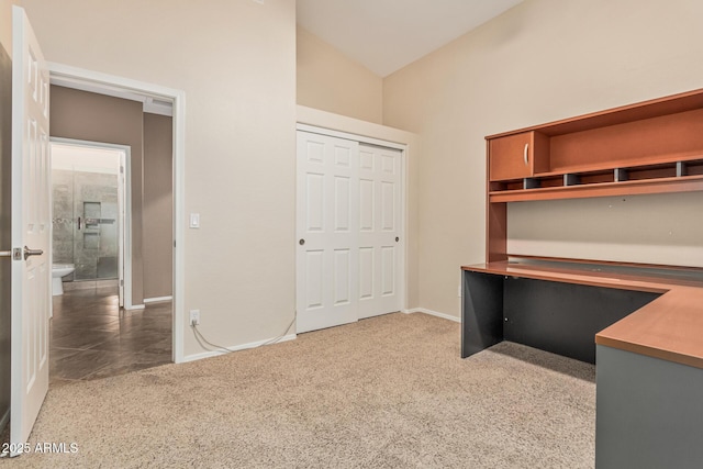 unfurnished office featuring carpet and baseboards