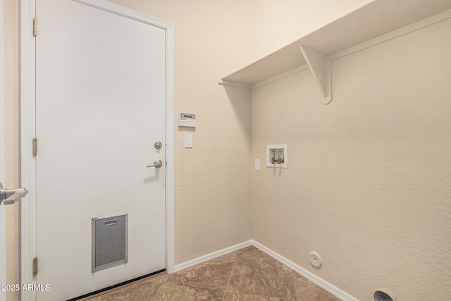 laundry room with gas dryer hookup, laundry area, baseboards, and washer hookup