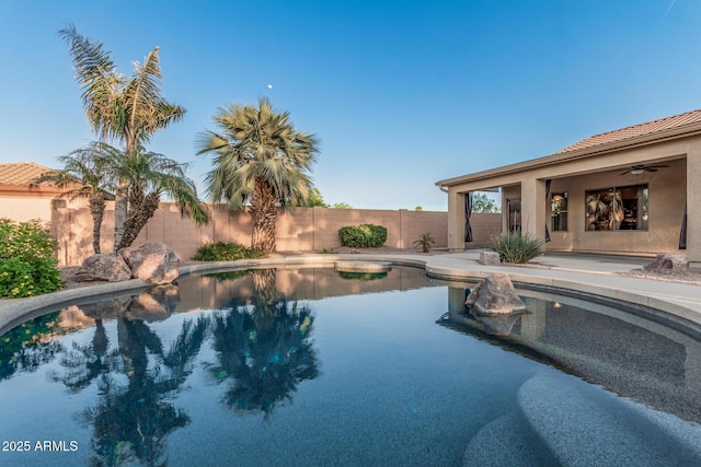 view of swimming pool with a fenced backyard and a fenced in pool