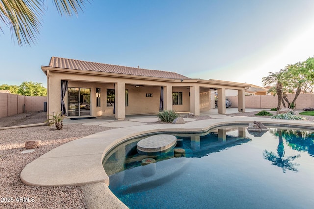 view of swimming pool with a patio area, a fenced backyard, ceiling fan, and a fenced in pool