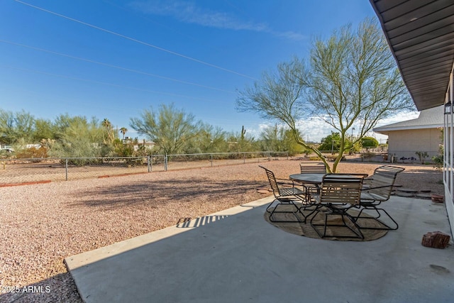 view of patio / terrace featuring outdoor dining area and fence