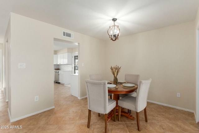 dining area featuring an inviting chandelier, baseboards, light tile patterned floors, and visible vents