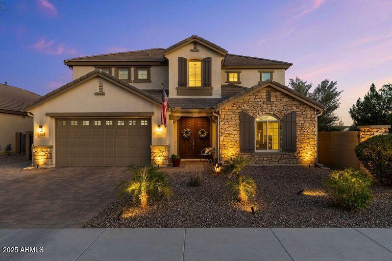 831 E Tonto Pl, Chandler, AZ 85249 - view of front of property featuring stone siding, stucco siding, decorative driveway, and an attached garage