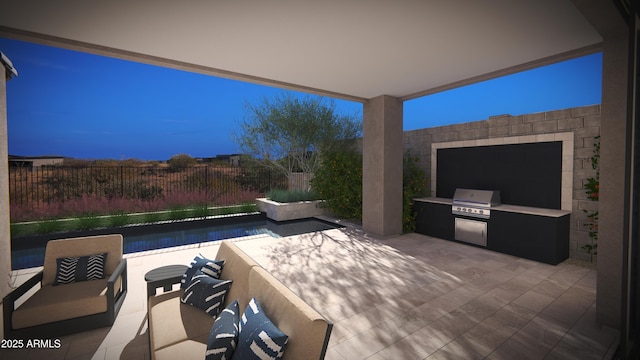 view of patio / terrace with a fenced backyard, grilling area, and exterior kitchen