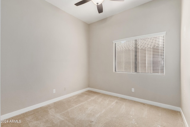 empty room with ceiling fan and carpet flooring