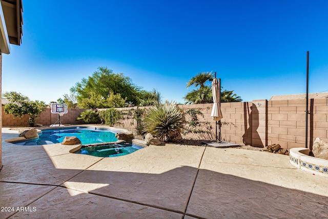 view of swimming pool with a patio