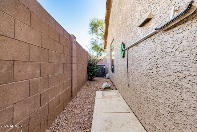 view of side of property featuring central air condition unit