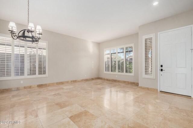 foyer with a notable chandelier