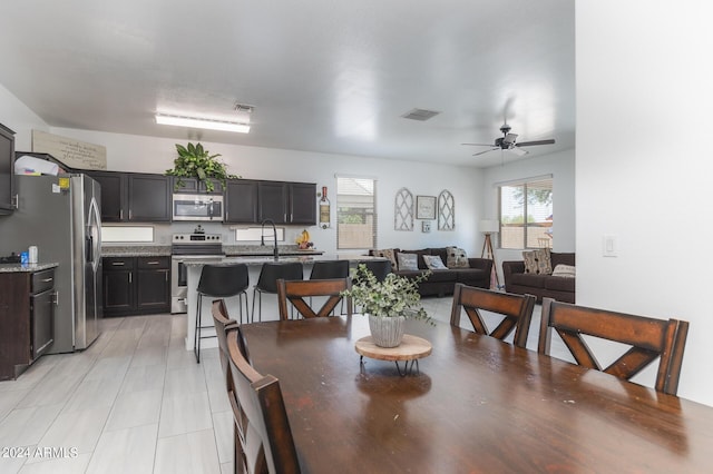 dining space featuring ceiling fan