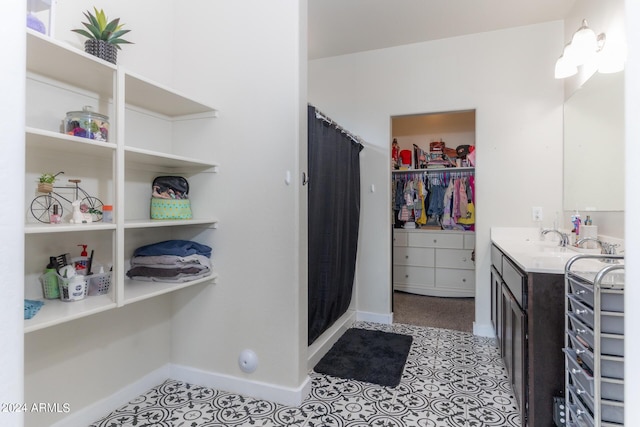 bathroom featuring vanity, tile patterned floors, and a shower with shower curtain