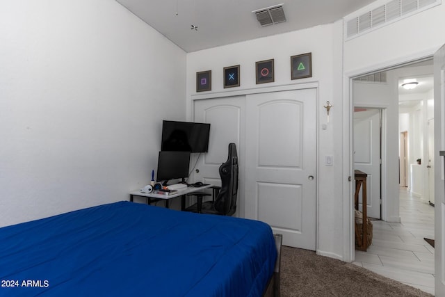 carpeted bedroom featuring a closet