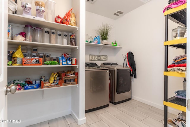 washroom featuring independent washer and dryer