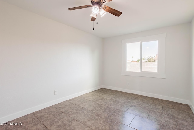 8021 W Hazelwood St, Phoenix, AZ 85033 - tiled spare room featuring baseboards and ceiling fan