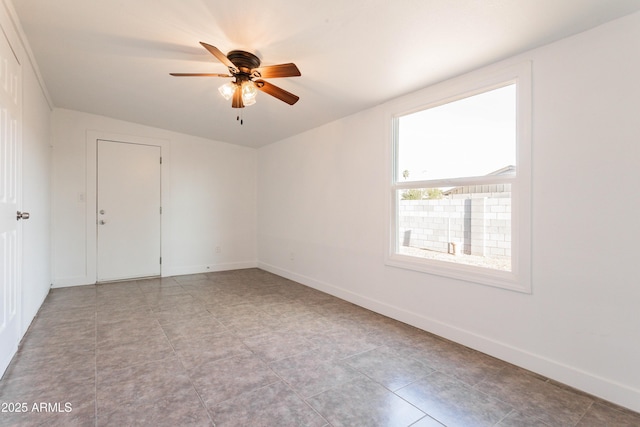 8021 W Hazelwood St, Phoenix, AZ 85033 - empty room with a ceiling fan and baseboards