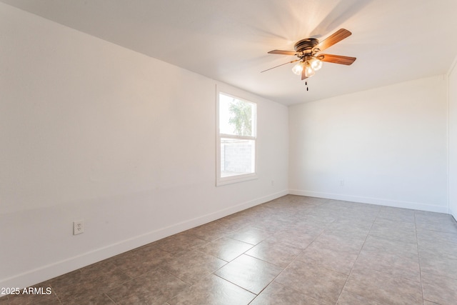 8021 W Hazelwood St, Phoenix, AZ 85033 - empty room with ceiling fan, baseboards, and light tile patterned flooring