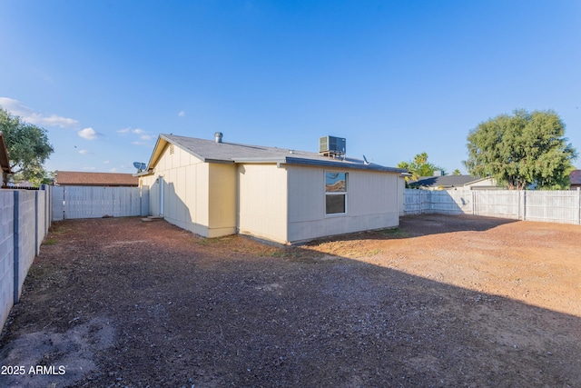 8021 W Hazelwood St, Phoenix, AZ 85033 - rear view of house with cooling unit and a fenced backyard