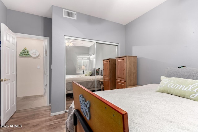 bedroom featuring hardwood / wood-style flooring and a closet