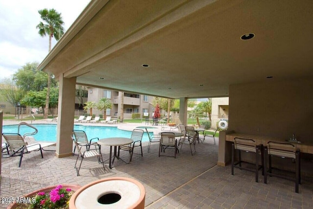 view of patio / terrace featuring a community pool