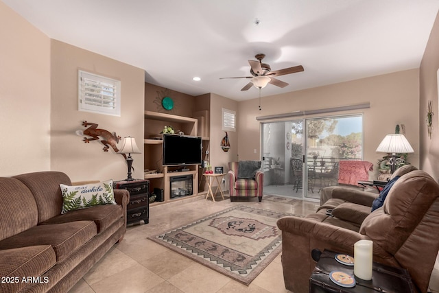 living room with light tile patterned floors and ceiling fan