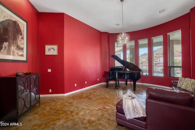 carpeted living room with a chandelier