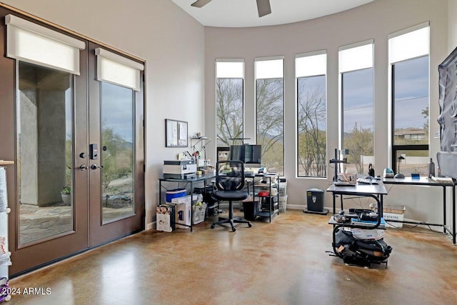 office space with french doors, concrete flooring, and ceiling fan