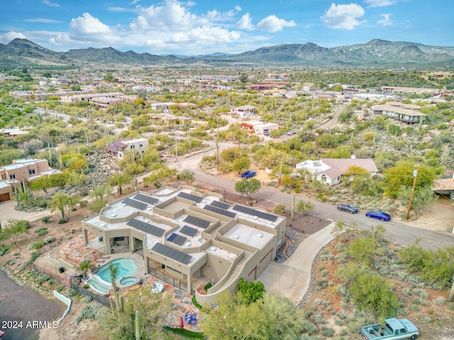 birds eye view of property featuring a mountain view