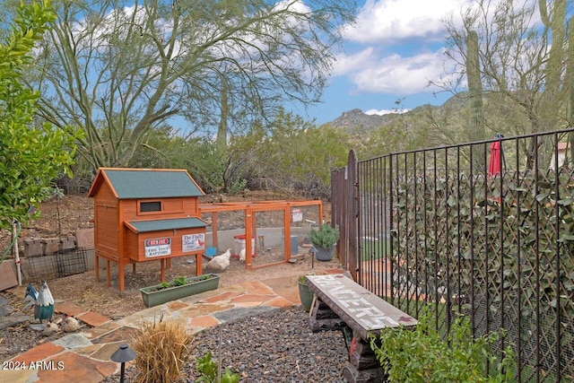 exterior space with an outbuilding and a mountain view