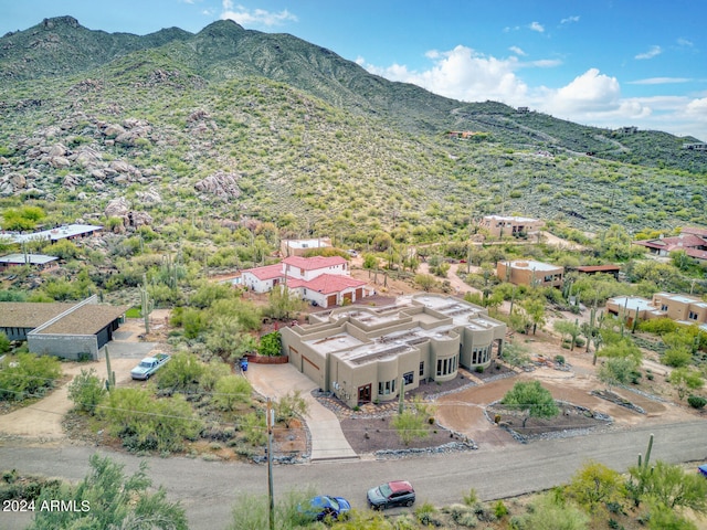 birds eye view of property with a mountain view