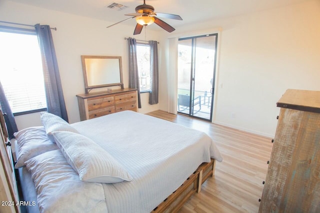 bedroom featuring ceiling fan, access to outside, and light hardwood / wood-style flooring