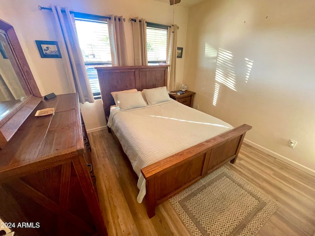 bedroom with light hardwood / wood-style floors