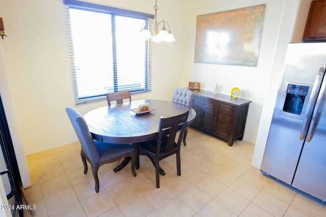 dining space with a healthy amount of sunlight and a notable chandelier