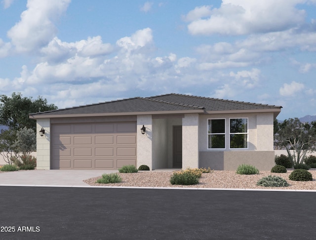 view of front of property featuring concrete driveway, an attached garage, and stucco siding