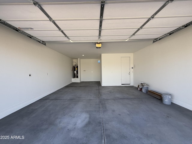 garage with water heater, baseboards, and a garage door opener