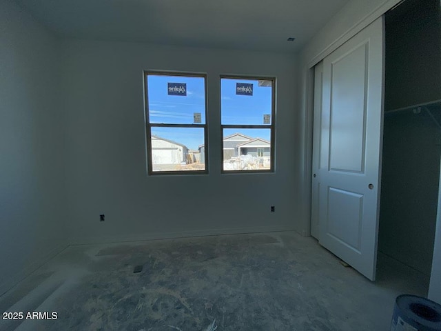 unfurnished bedroom with a closet