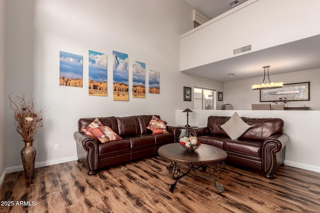 7247 W Buckskin Trl, Peoria, AZ 85383 - living area featuring wood finished floors and a towering ceiling