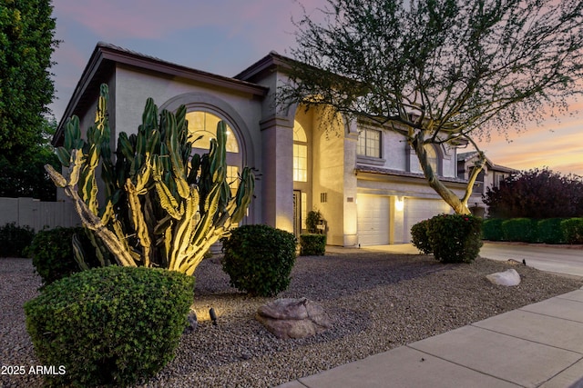 7247 W Buckskin Trl, Peoria, AZ 85383 - view of front of home featuring an attached garage, stucco siding, and driveway