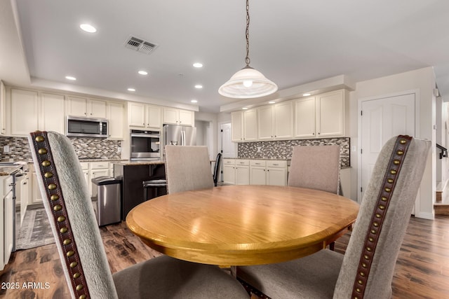 7247 W Buckskin Trl, Peoria, AZ 85383 - dining room with recessed lighting and dark wood-style flooring