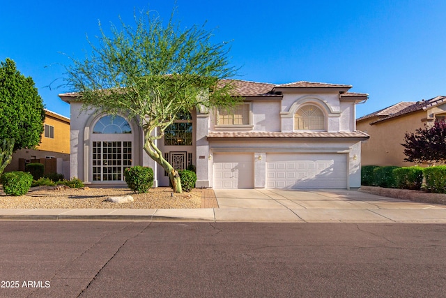 7247 W Buckskin Trl, Peoria, AZ 85383 - mediterranean / spanish home featuring stucco siding, an attached garage, driveway, and a tile roof