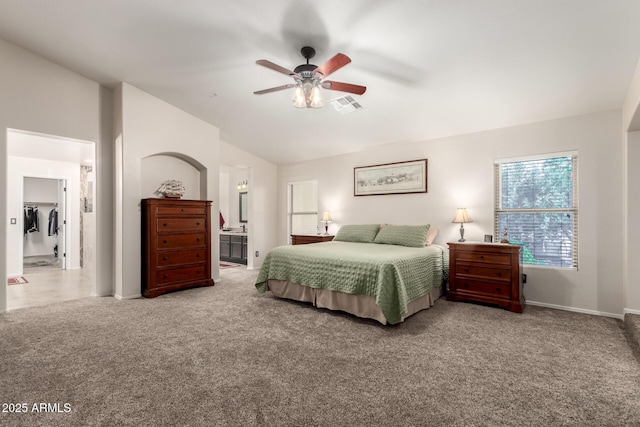 7247 W Buckskin Trl, Peoria, AZ 85383 - bedroom with carpet, vaulted ceiling, ensuite bathroom, and ceiling fan