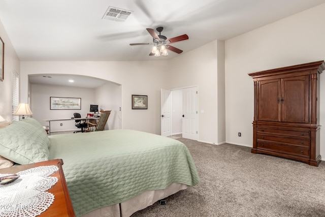 7247 W Buckskin Trl, Peoria, AZ 85383 - bedroom with arched walkways, lofted ceiling, a desk, carpet flooring, and ceiling fan